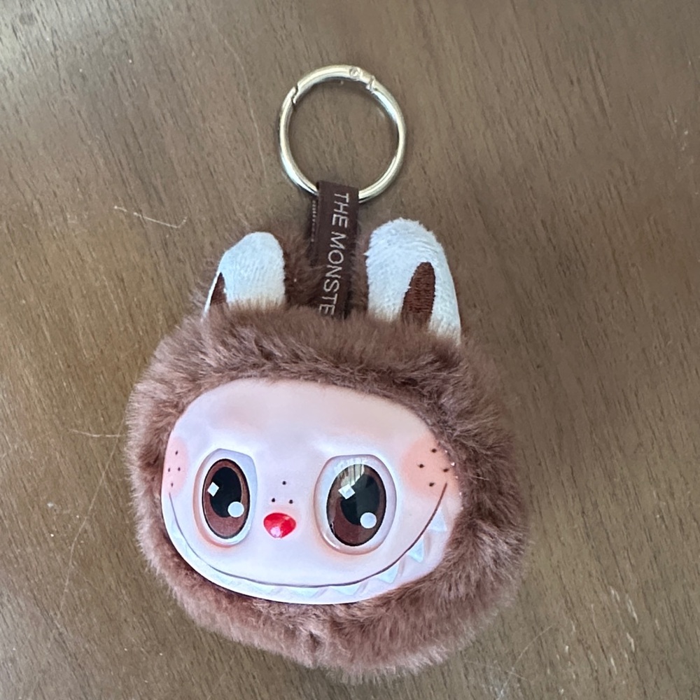 The monsters Brown labubu head Keychain